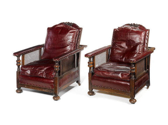 Bonhams : A pair of early 20th century caned oak reclining armchairs