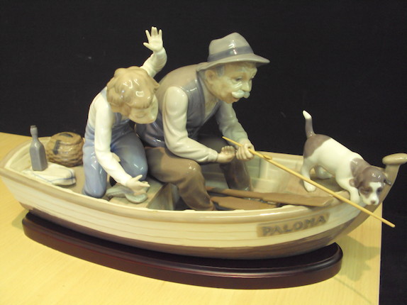 Bonhams : A Lladro figure group of man and boy fishing in a boat