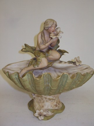 Bonhams : A Royal Dux figurine of a girl in a seashell