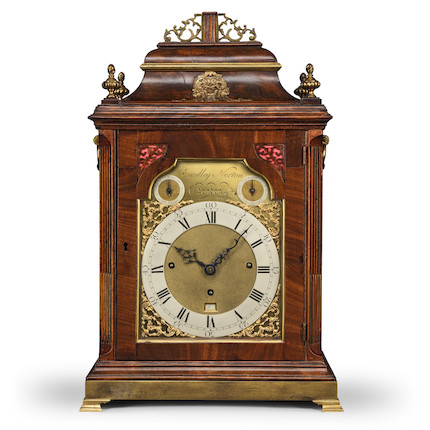A large English brass quarter chiming skeleton clock with calendar