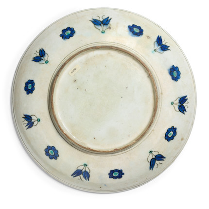 Bonhams : A fine Iznik rimless pottery dish Turkey, circa 1575