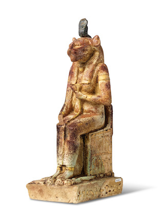 Bonhams : An Egyptian inlaid bichrome faience enthroned Bastet with ...