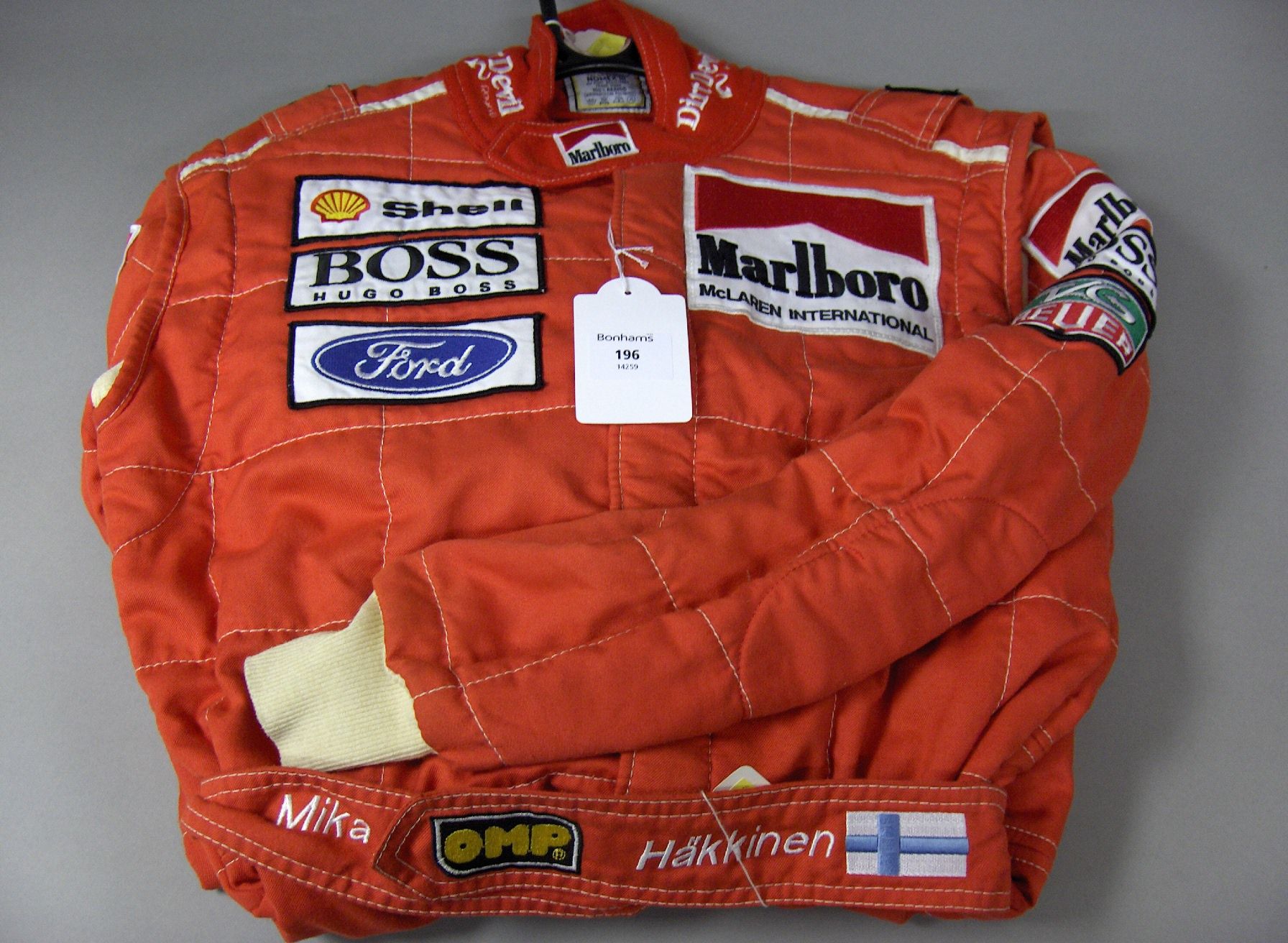 Bonhams Cars : A Mika Hakkinen race worn McLaren suit,