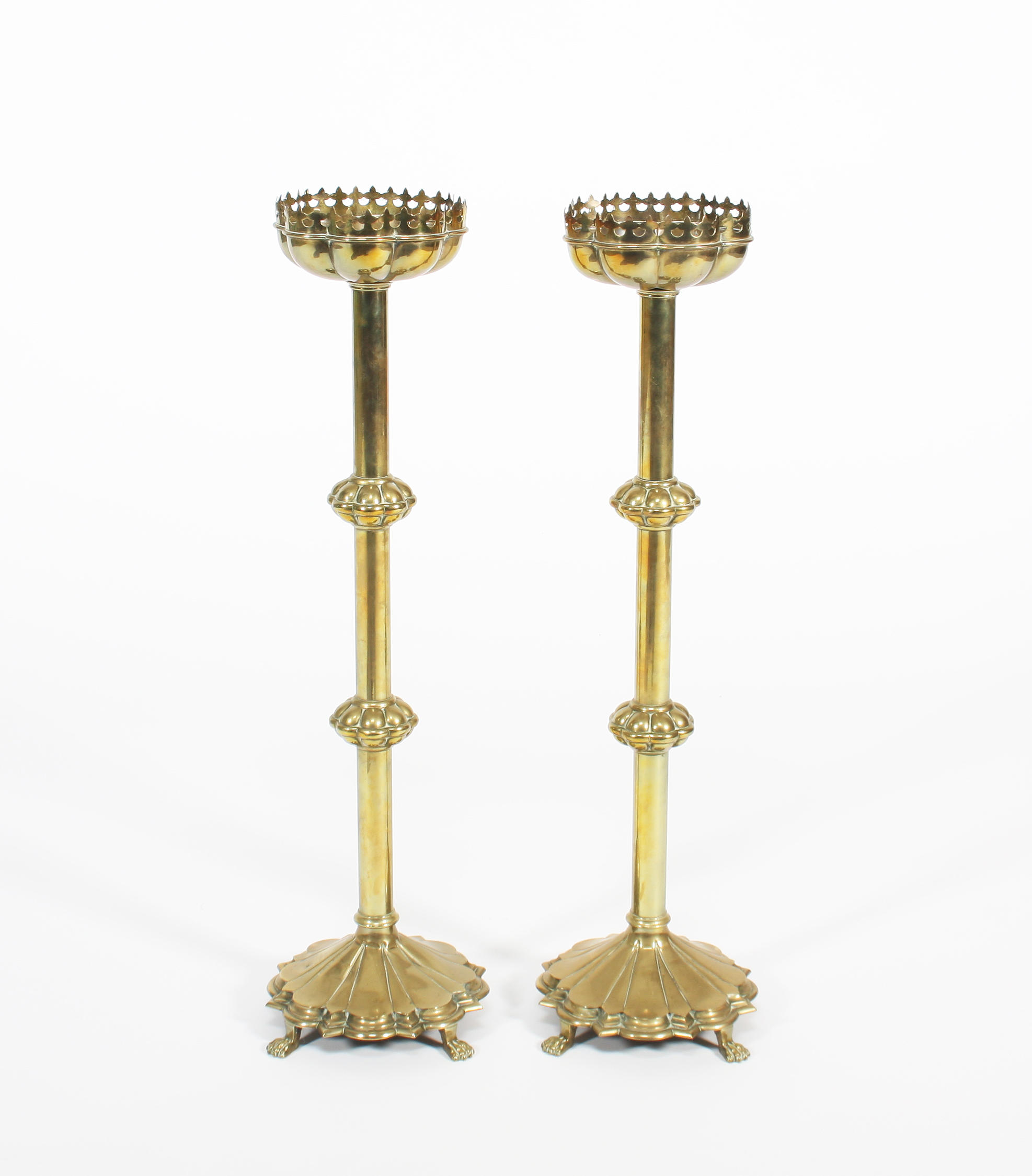 Lot - A PAIR OF ECCLESIASTICAL GOTHIC REVIVAL GILT BRASS PRICKET  CANDLESTICKS, ENGLISH, SECOND HALF 19TH CENTURY