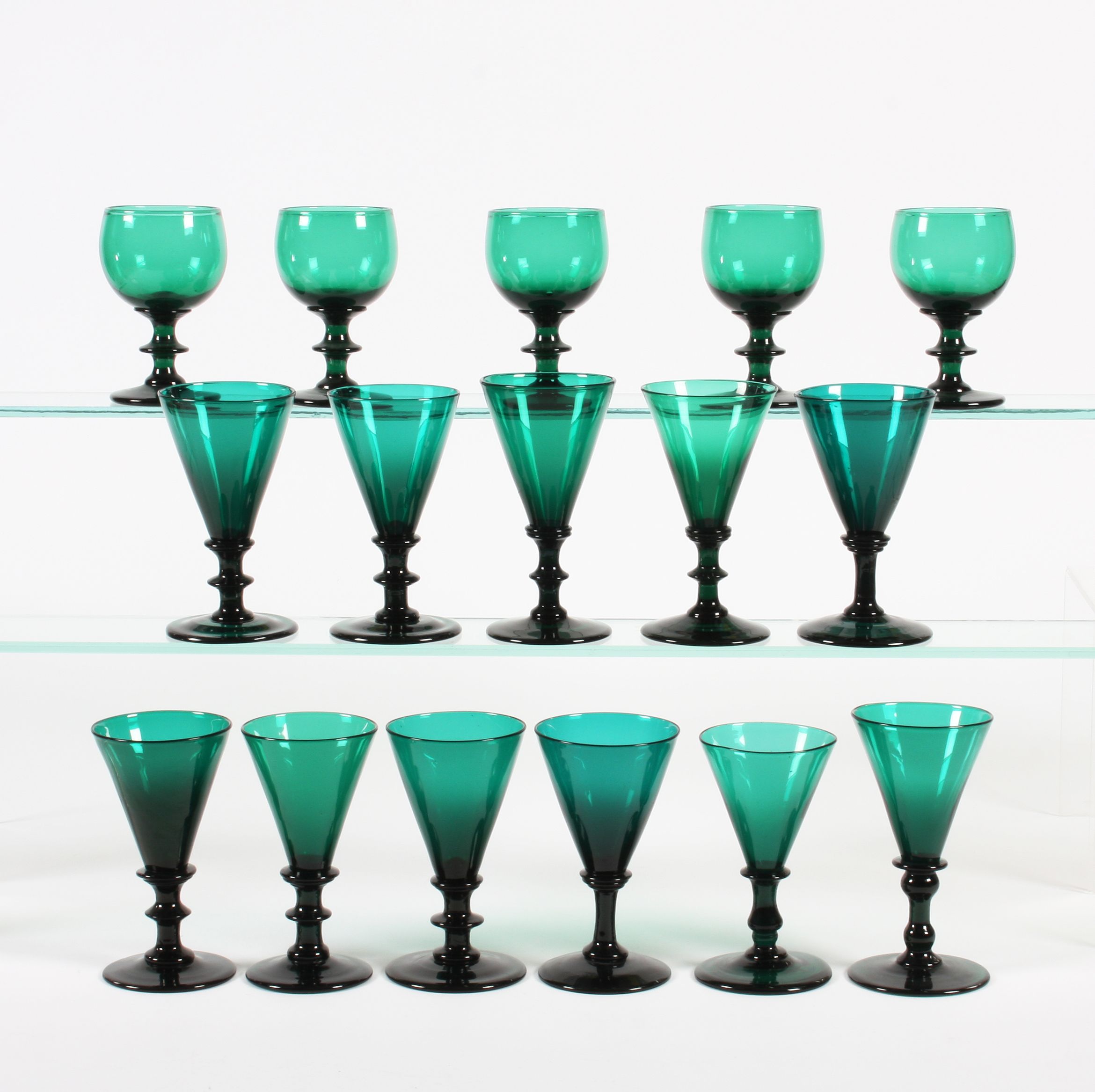 Bonhams A group of greentinted wine glasses Early 19th Century.