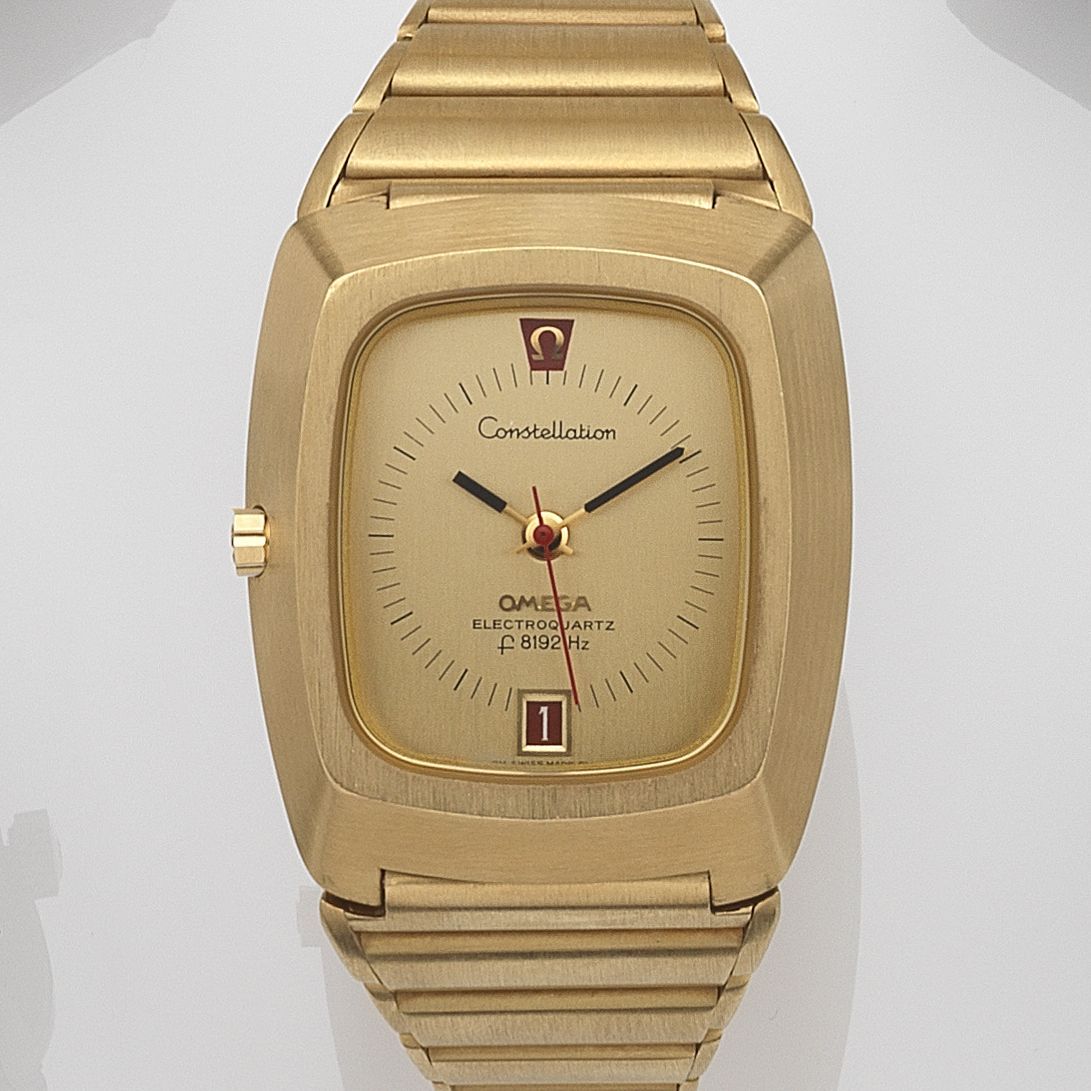 Bonhams : Omega. An 18ct gold quartz calendar bracelet watch  