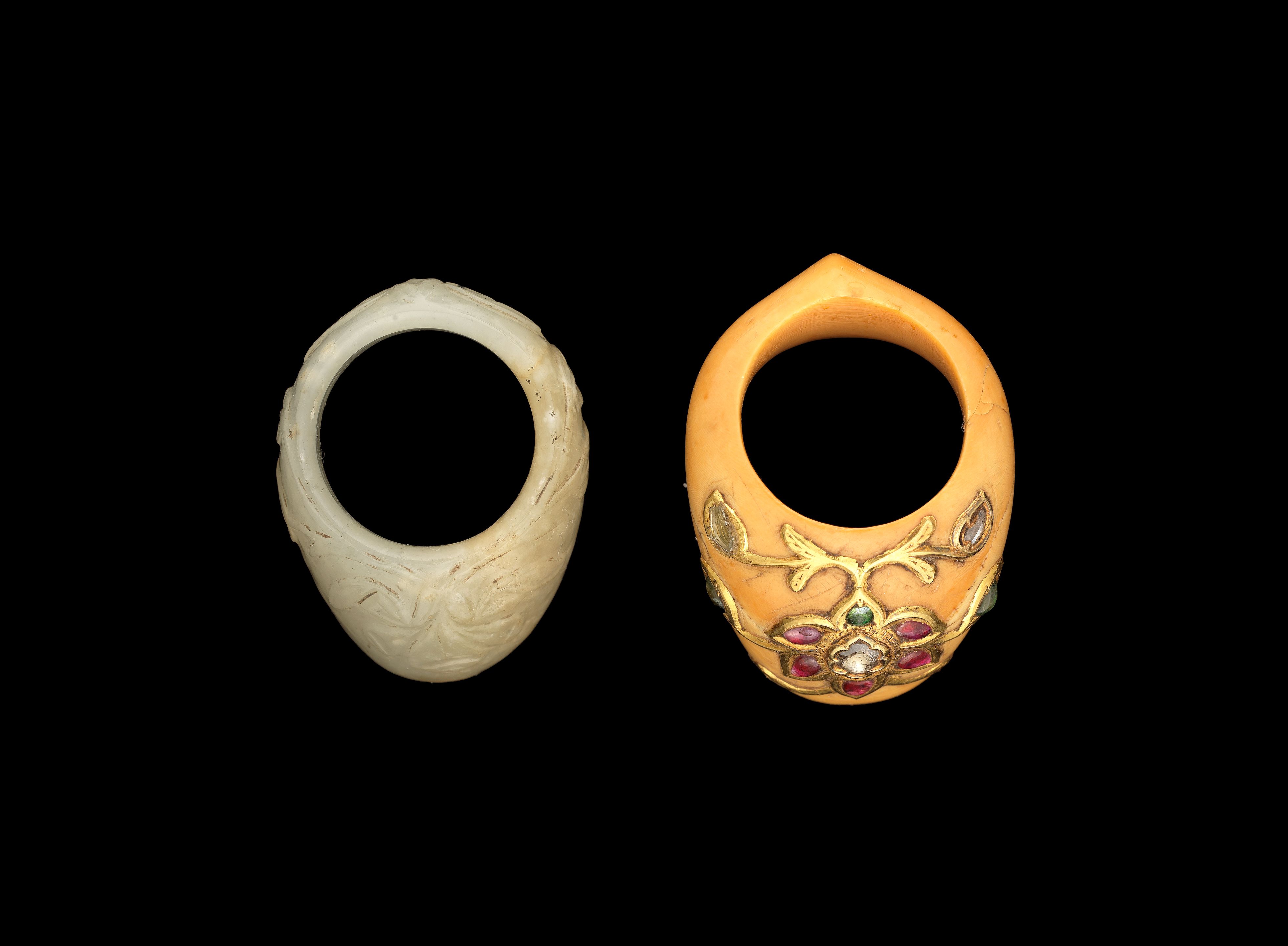 Bonhams A Mughal gem-set ivory Archer's Ring; and a Mughal jade