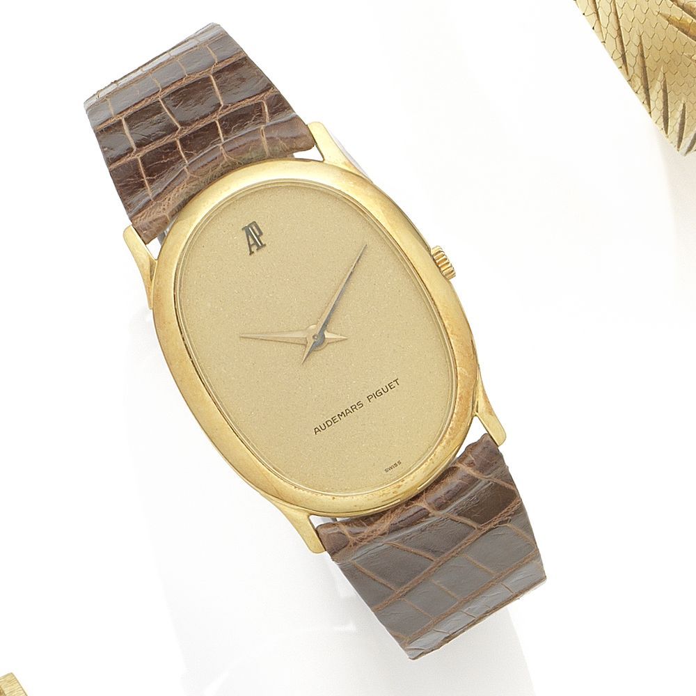 Bonhams Audemars An 18k gold manual wind oval wristwatch