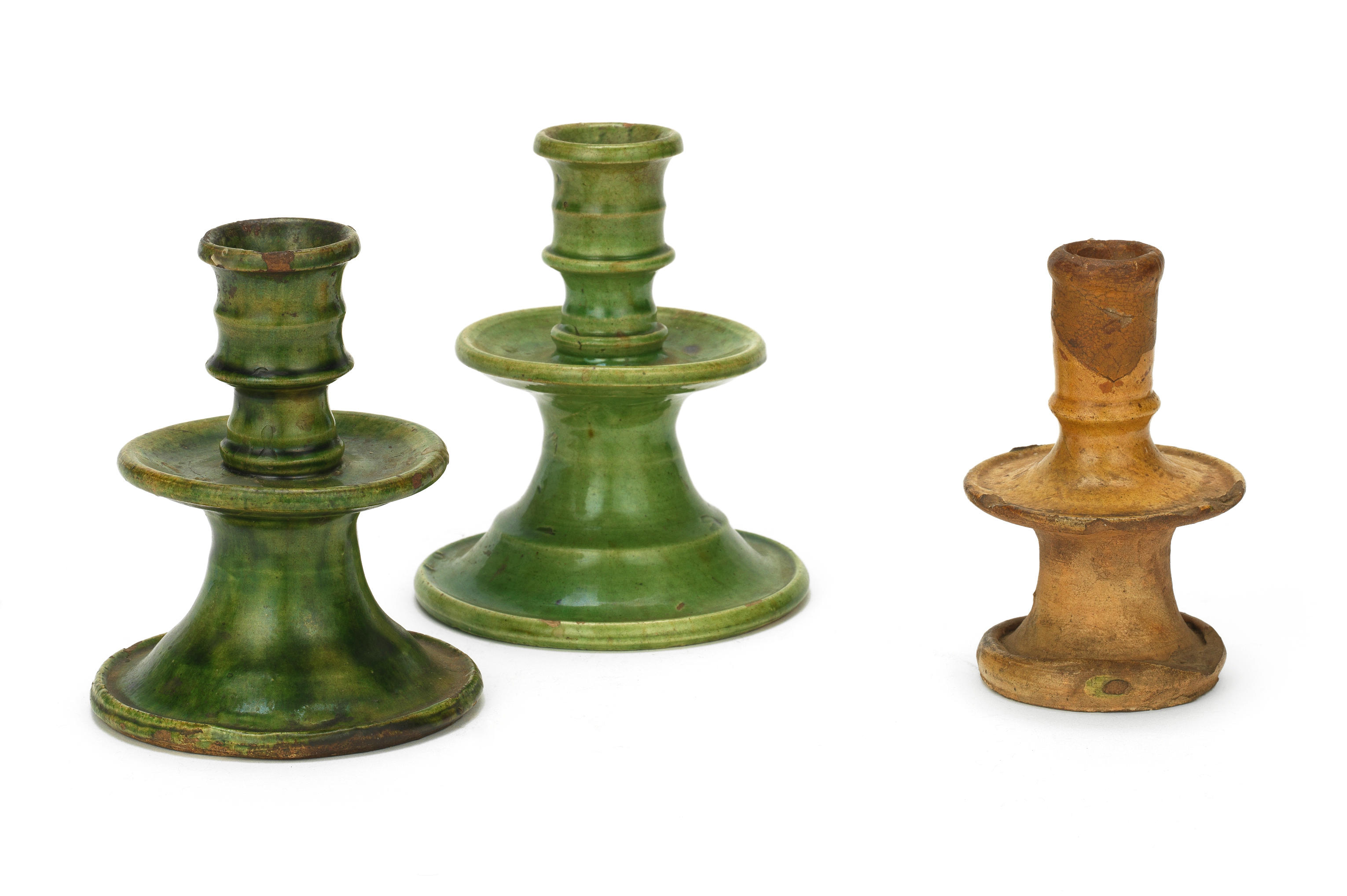 Three 17th century pottery candlesticks, Northern European - Bonhams