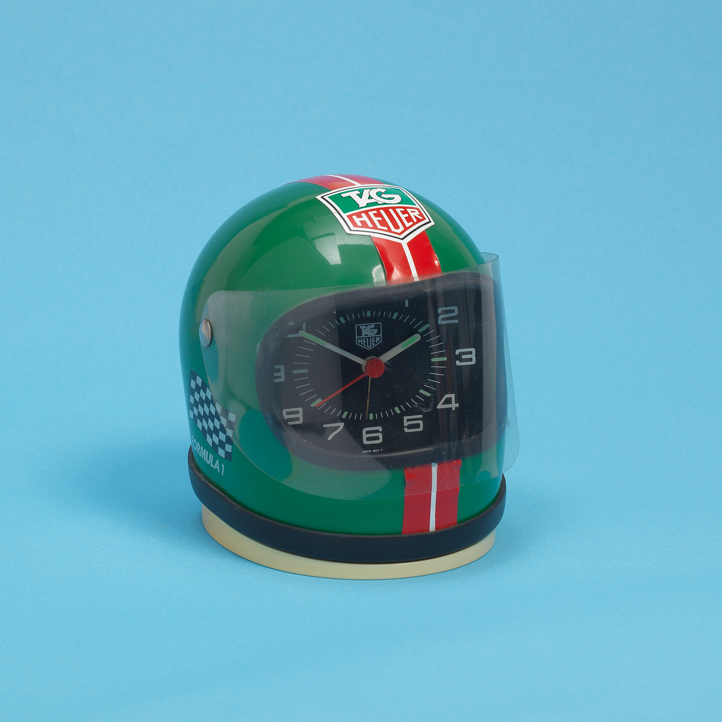 Bonhams : TAG Heuer. A miniature racing helmet desk clock with 