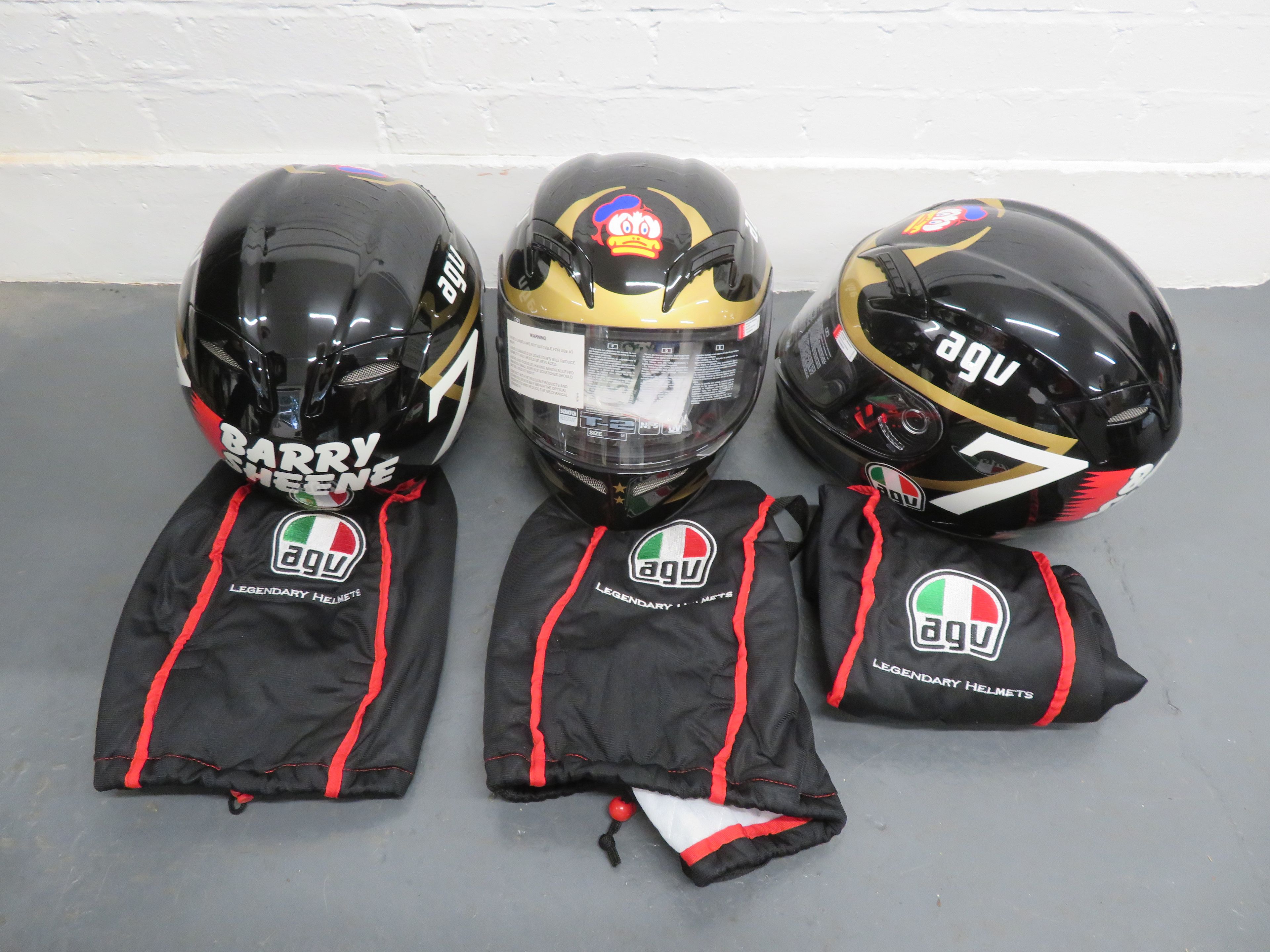 Bonhams Cars Three AGV Barry Sheene replica helmets ((3))