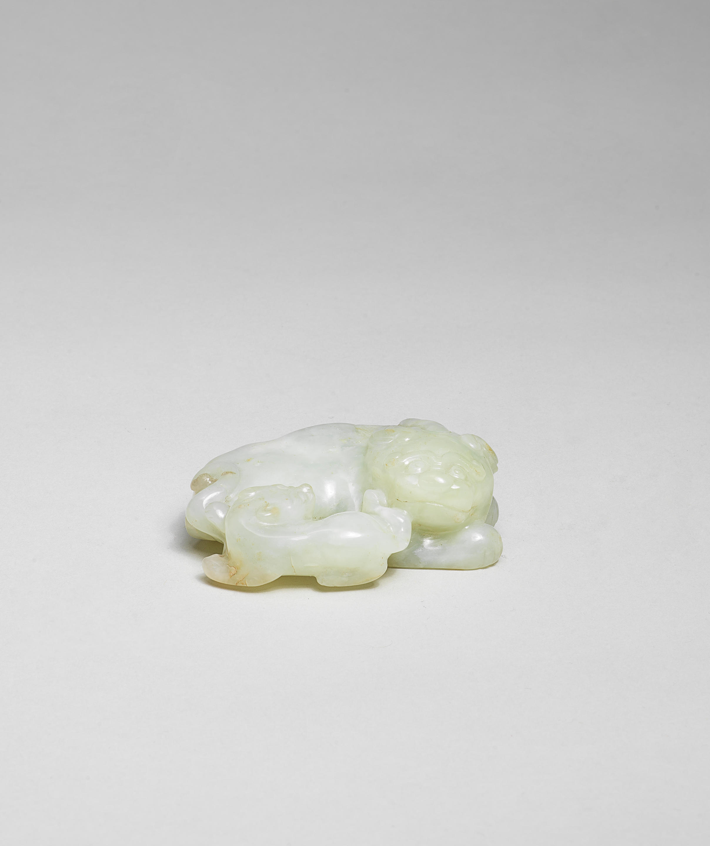 Bonhams : A PALE GREEN JADE CARVING OF A MYTHICAL BEAST AND CUB 17th ...