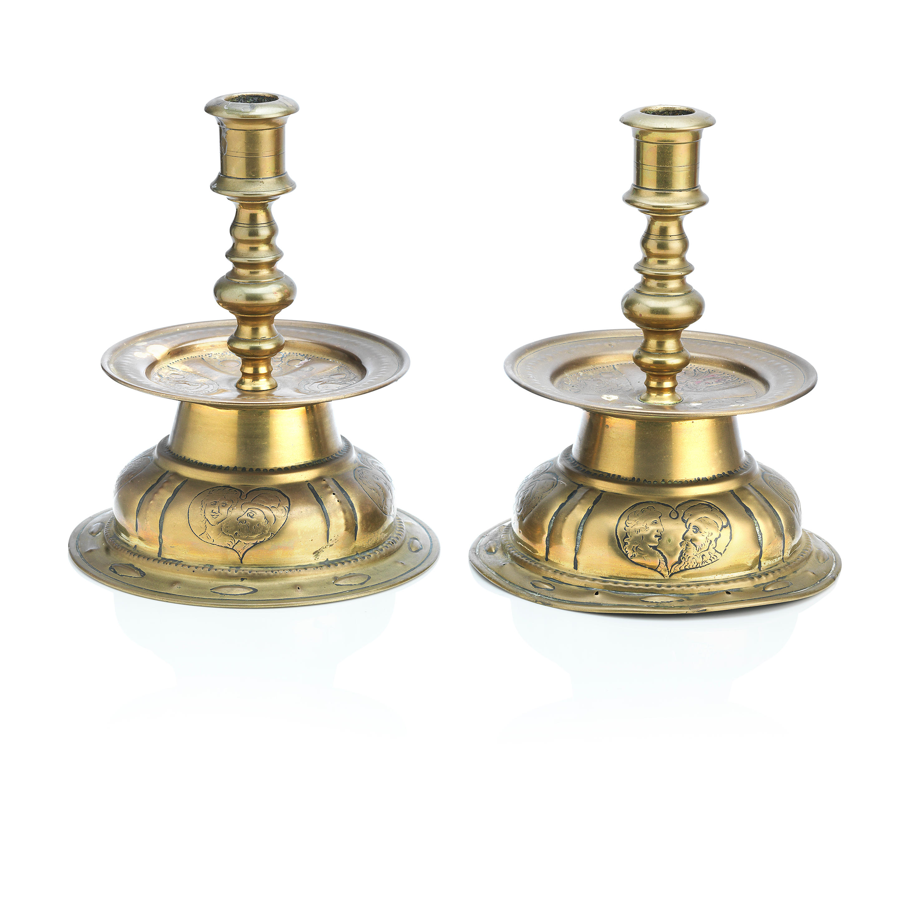 Bonhams : A pair of 17th century brass alloy pricket candlesticks