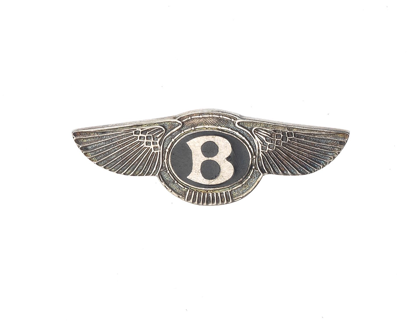 Bonhams Cars : A silver Bentley 'Winged B' lapel badge, 1954,