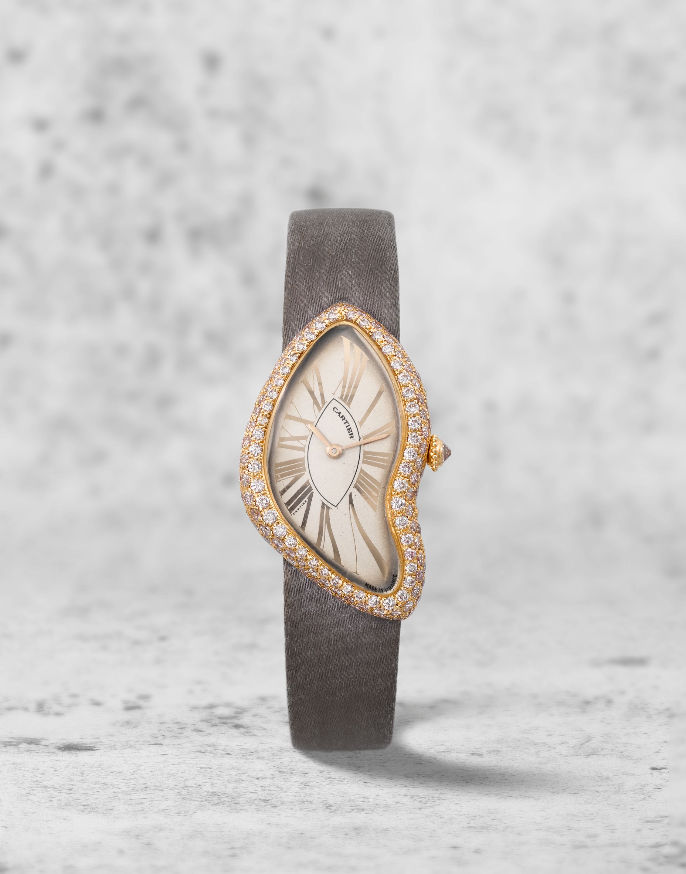 Bonhams : Cartier. A rare and unusual 18K rose gold manual wind